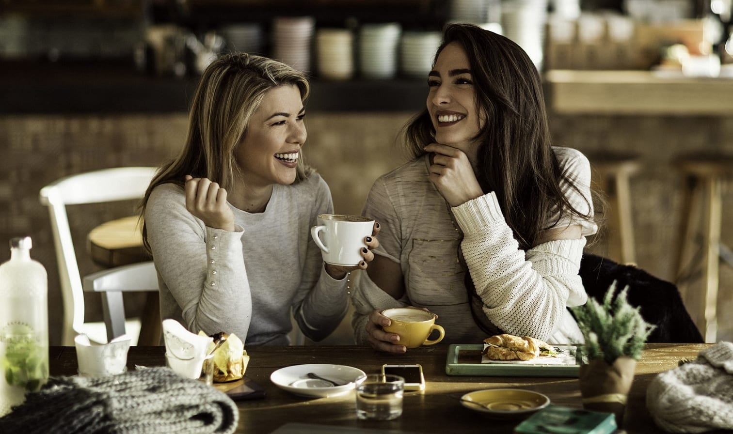 Coffee Shop with Two Smiling Women